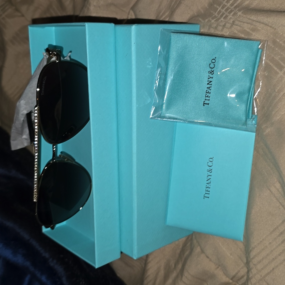 Authentic Tiffany and Co.  Pale Gold-colored Metal with Gray Gradient Lens